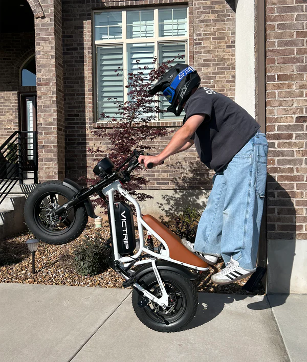 Rider performing a wheelie on VICTRIP R6