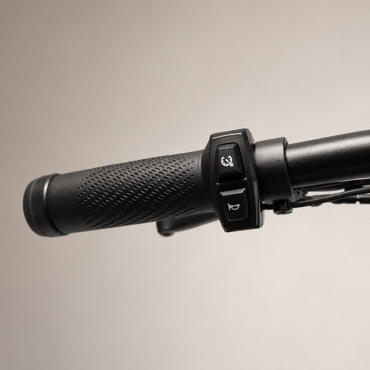 Handlebar grip with thumb control buttons and horn